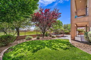 Fenced backyard with a jacuzzi and a patio area