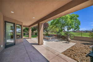 Fenced backyard with a patio area
