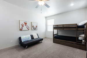 Bedroom with carpet, ceiling fan, and recessed lighting