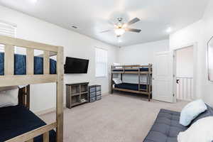 Bedroom featuring carpet floors and a ceiling fan
