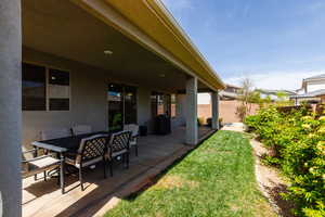 View of yard featuring a patio area and outdoor dining area
