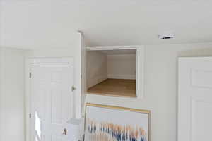 Detailed view of a smoke detector and baseboards