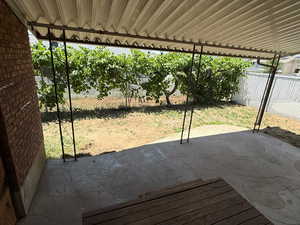 Fenced backyard featuring a patio area