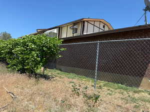 View of side of property with brick siding