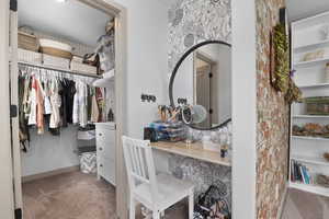 Spacious closet featuring carpet