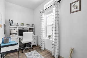 Office featuring wood finished floors and baseboards