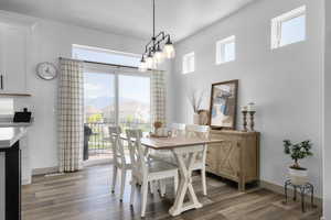 Dining room featuring wood finished floors and baseboards