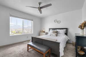 Bedroom featuring carpet floors and ceiling fan