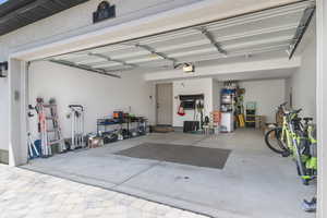 Garage featuring a garage door opener