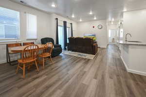 Dining area featuring wood finished floors and recessed lighting