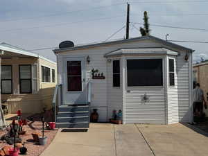 View of front facade featuring entry steps