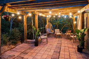 Patio at twilight with a patio area and a pergola