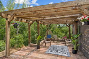 View of patio with a pergola