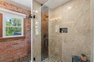 Full bath featuring a stall shower