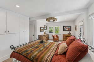 Bedroom with recessed lighting and light wood-style floors