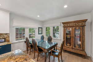 Dining room featuring light wood-style floors and recessed lighting
