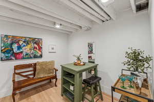 Detailed view of wood finished floors and beamed ceiling