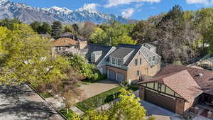 Aerial view of property and surrounding area with mountains