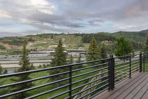 Wooden deck featuring a mountain view