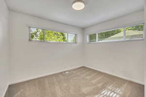 Unfurnished room featuring carpet