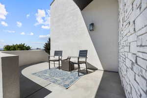 Patio adjacent to front door looks east towards the Wasatch.