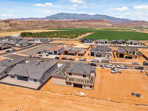Aerial perspective of suburban area featuring a mountainous background