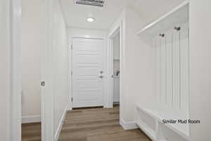 Mudroom featuring wood finished floors and recessed lighting