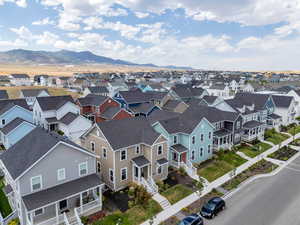 Aerial perspective of suburban area featuring a mountain backdrop