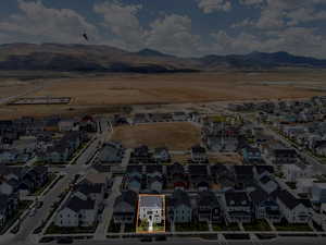 Aerial view of residential area with mountains