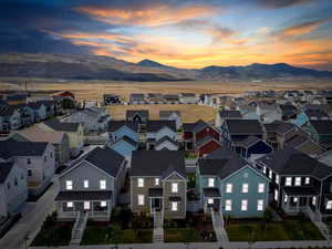 Aerial perspective of suburban area featuring a mountainous background