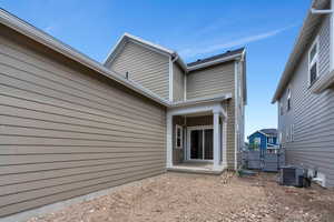 Rear view of property with a gate