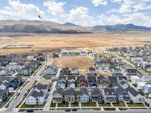 Aerial view of residential area featuring a mountainous background