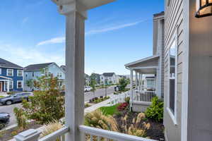 Covered porch with a residential view