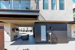View of patio with an outdoor living space with a fireplace