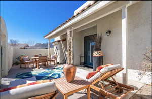 Fenced backyard featuring outdoor dining area and a patio