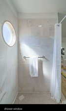 Full bath with a tile shower