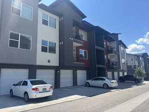 View of property with garage.