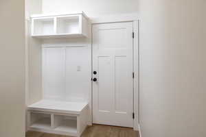 Mudroom featuring light wood-style flooring