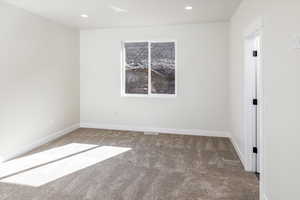 Spare room with carpet flooring and recessed lighting