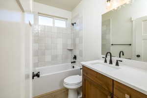 Full bathroom with vanity,  shower combination, and wood finished floors