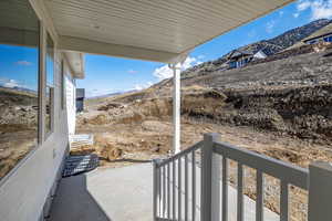 View of patio featuring a mountain view
