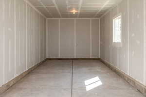 Unfurnished room featuring concrete floors