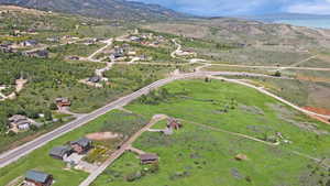 Aerial overview of property's location with a mountainous background