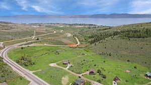 Aerial overview of property's location featuring a water and mountain view