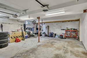 2-Car Garage with a garage door opener and extra space in back for storage