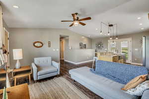 Living room featuring vaulted ceilings and open concept