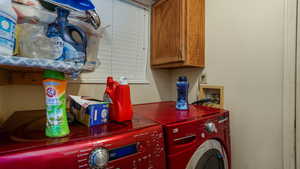 Washroom with washing machine and dryer and cabinet space