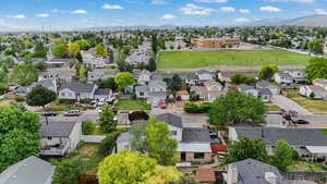 Aerial perspective of suburban area featuring a mountain backdrop