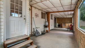 Property entrance featuring covered porch