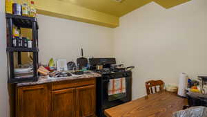 Kitchen with gas stove and a sink